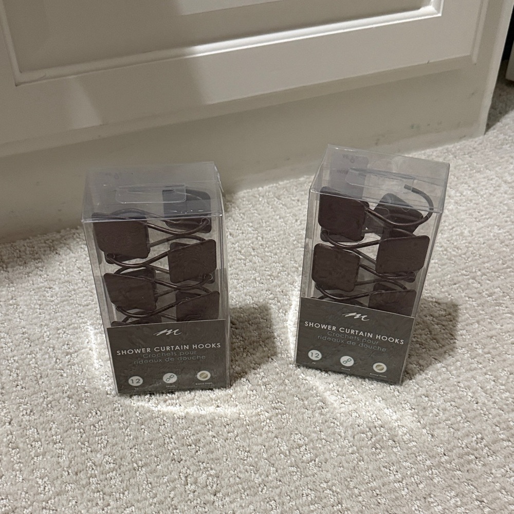 Oil rubbed bronze shower curtain hooks.